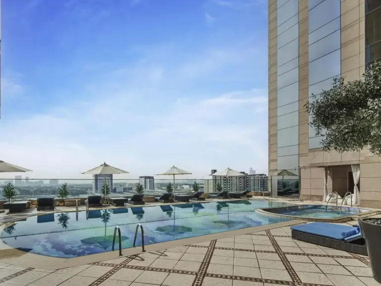 Swimming pool at Fairmont Dubai with city views