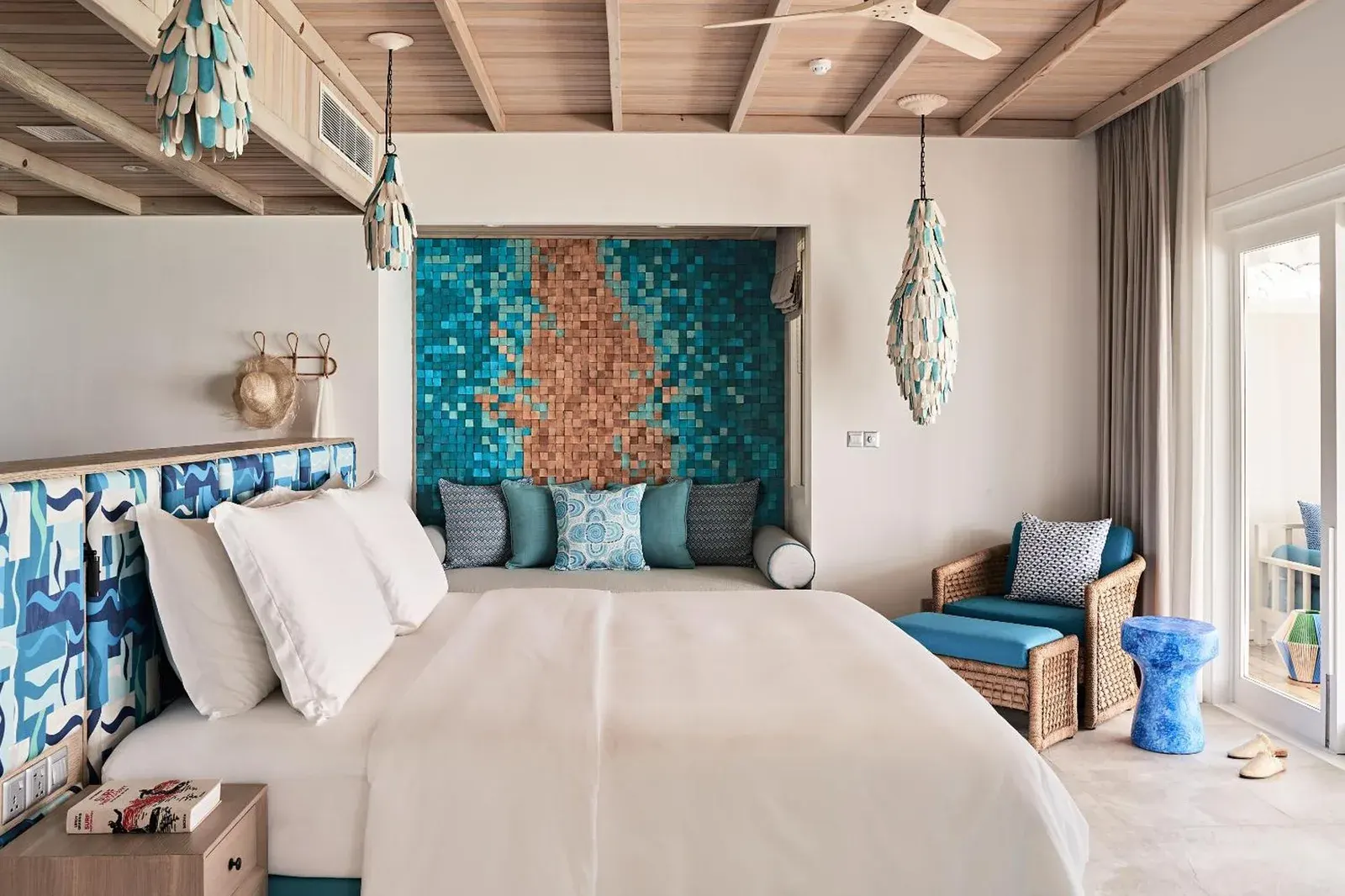 Decorative interior of a bedroom at Finolhu, A Seaside Collection Resort.