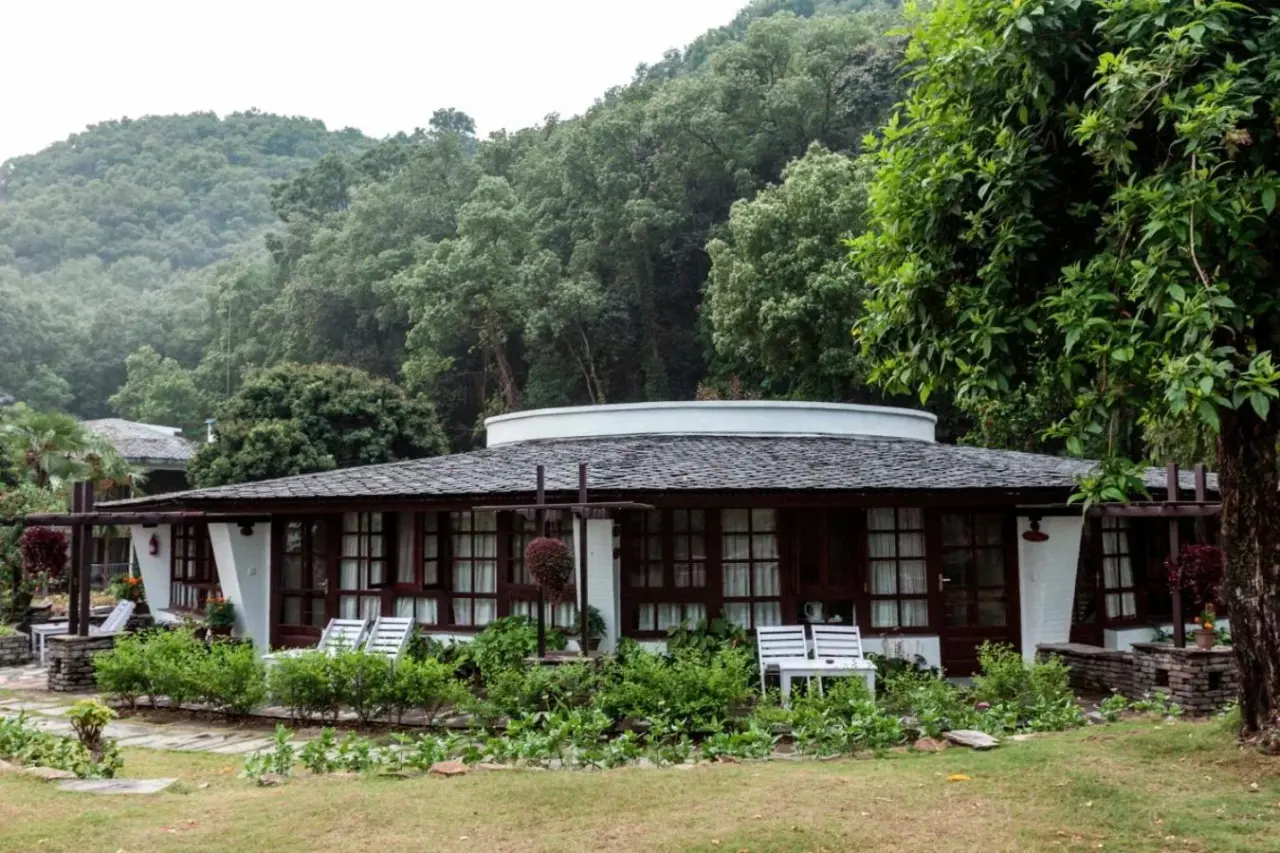 Cottage view at Fish Tail Lodge in Pokhara with garden.