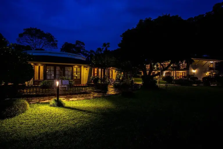 Nighttime view of Fish Tail Lodge in Pokhara illuminated by lights.