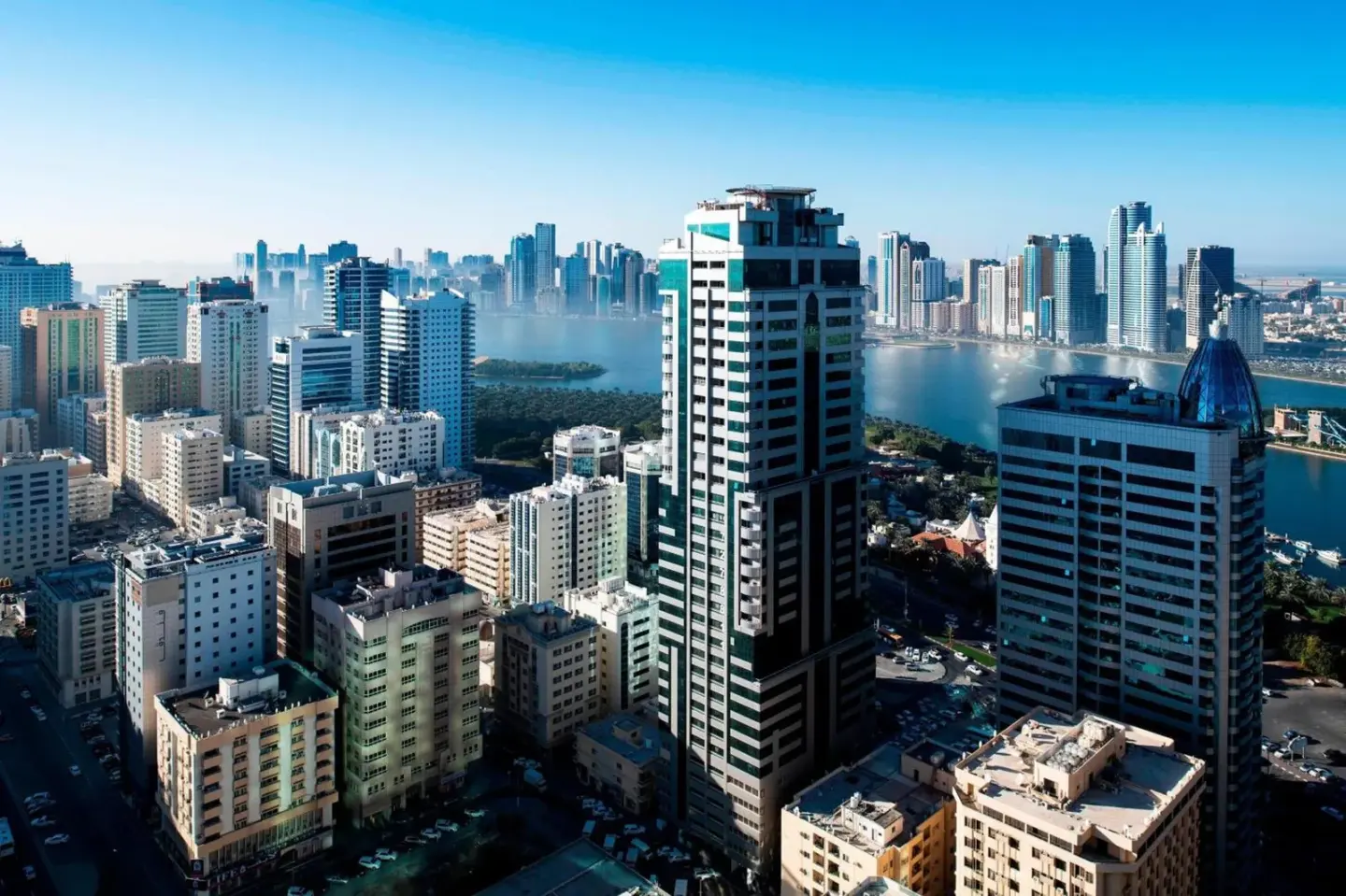 Aerial skyline view from Four Points by Sheraton Sharjah showing Sharjah towers and waterfront.