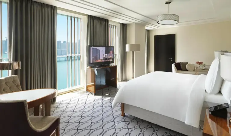 Bright guest room with waterfront view at Four Seasons Hotel Abu Dhabi