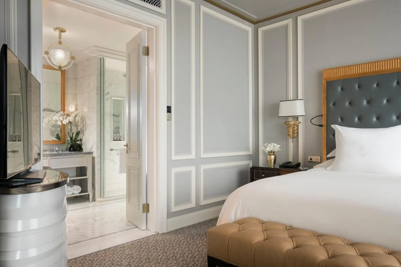 Guest room with bathroom at Four Seasons Hotel Jakarta