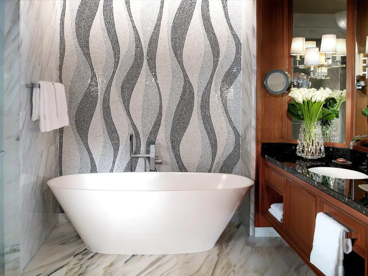 Sophisticated bathroom featuring a tub at Four Seasons Resort Dubai