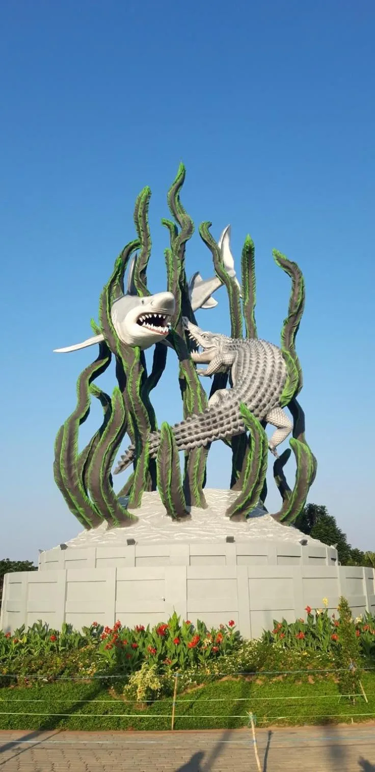 Gatotkaca Hotels Surabaya exterior photo showing the iconic Suro and Boyo monument in the city