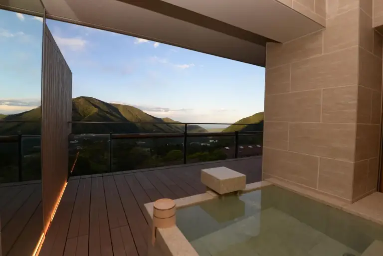 Outdoor bath with mountain view at Gen Hakone Gora