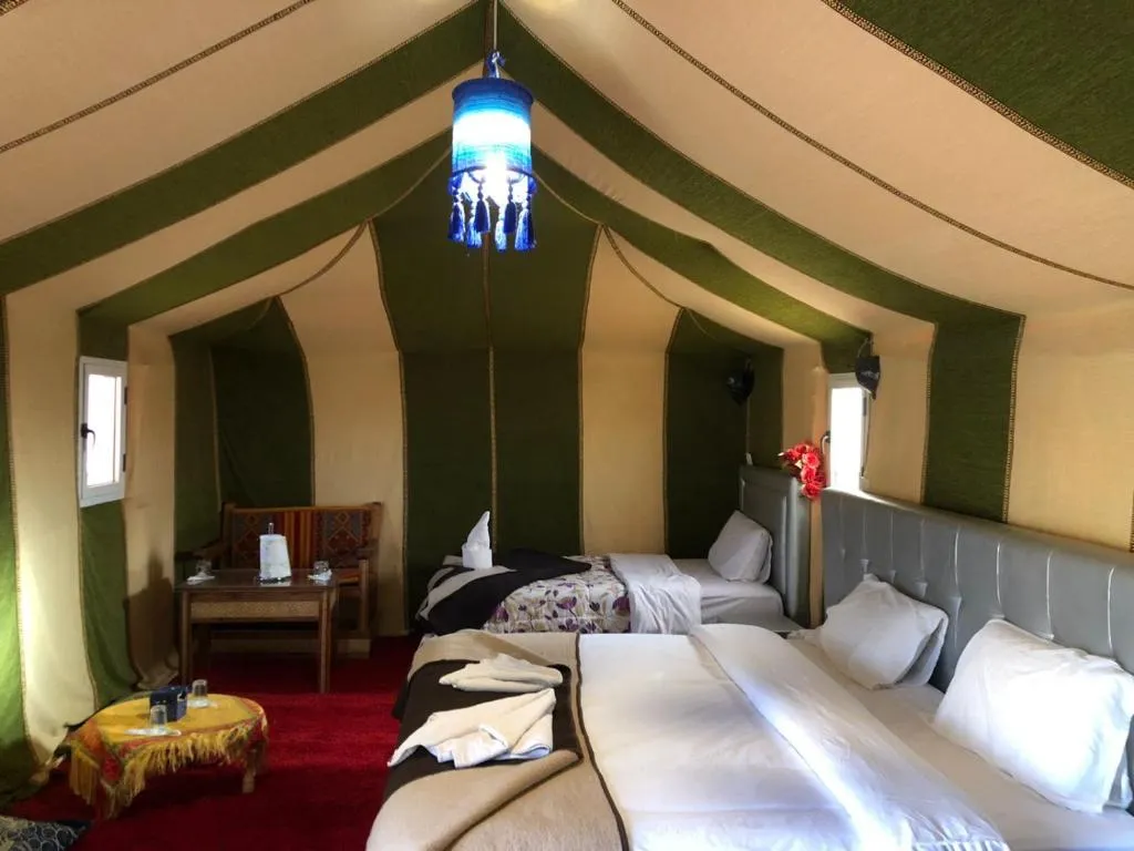 Elegant interior of a tent at Glamorous Luxury Camp in Merzouga