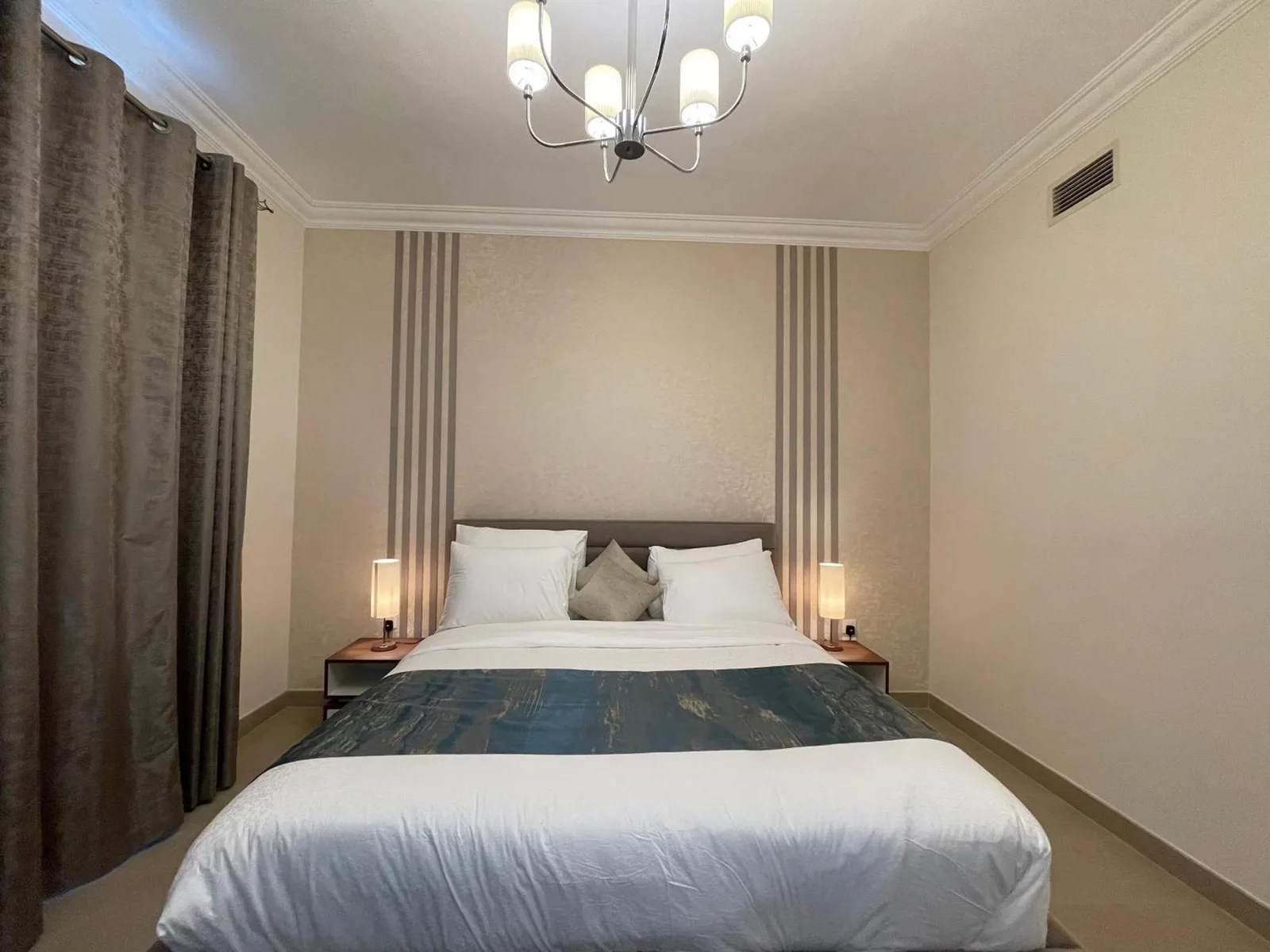 Comfortable bedroom at Goodwood Suites Homes Vacation in Dubai