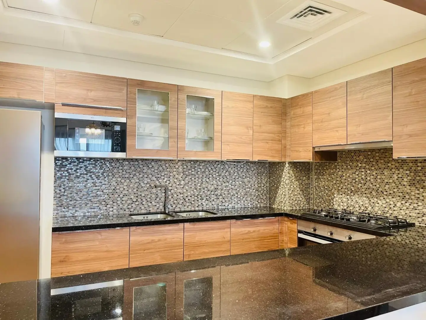 Fully equipped kitchen at Goodwood Suites Homes Vacation in Dubai