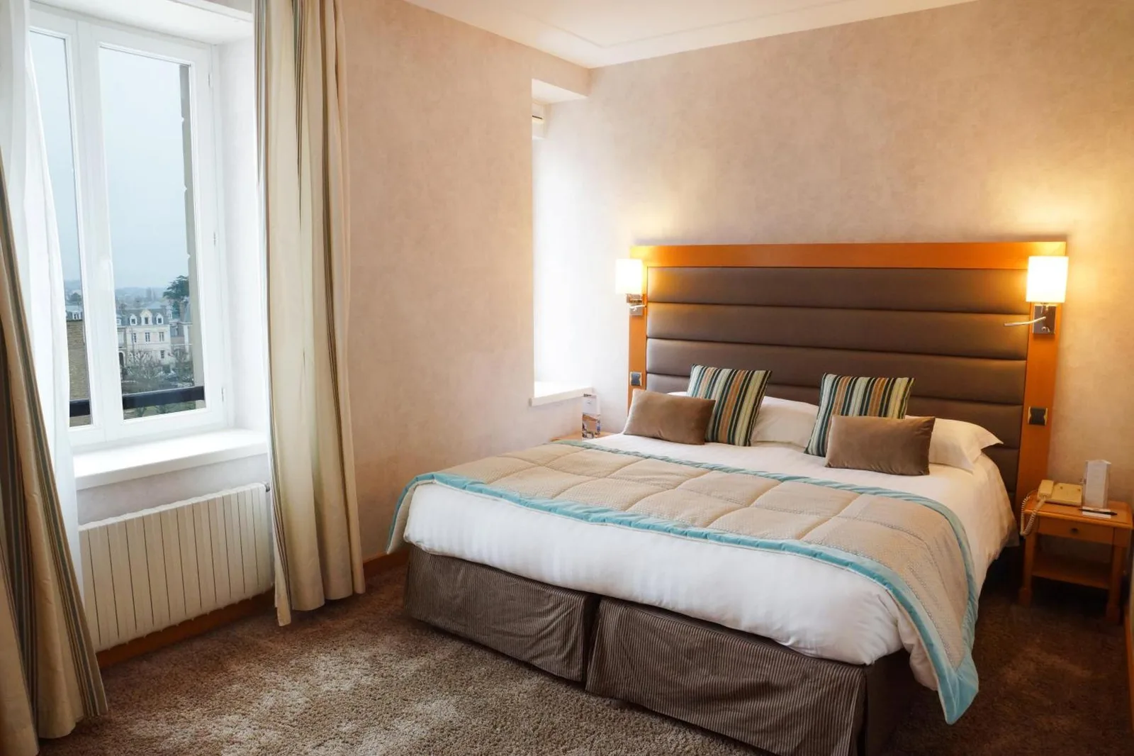 Cozy room at Grand Hôtel Des Thermes with comfortable bed