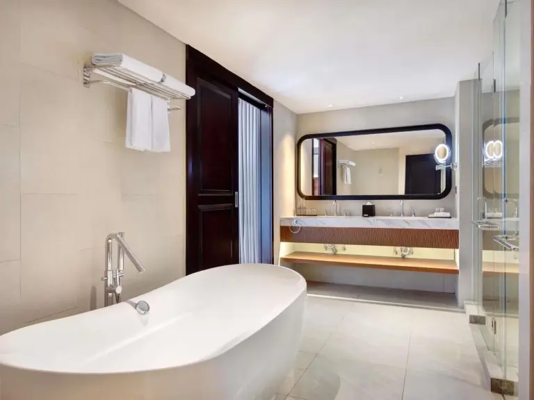 Luxury bathroom with freestanding tub at Grand Mercure Bali Seminyak