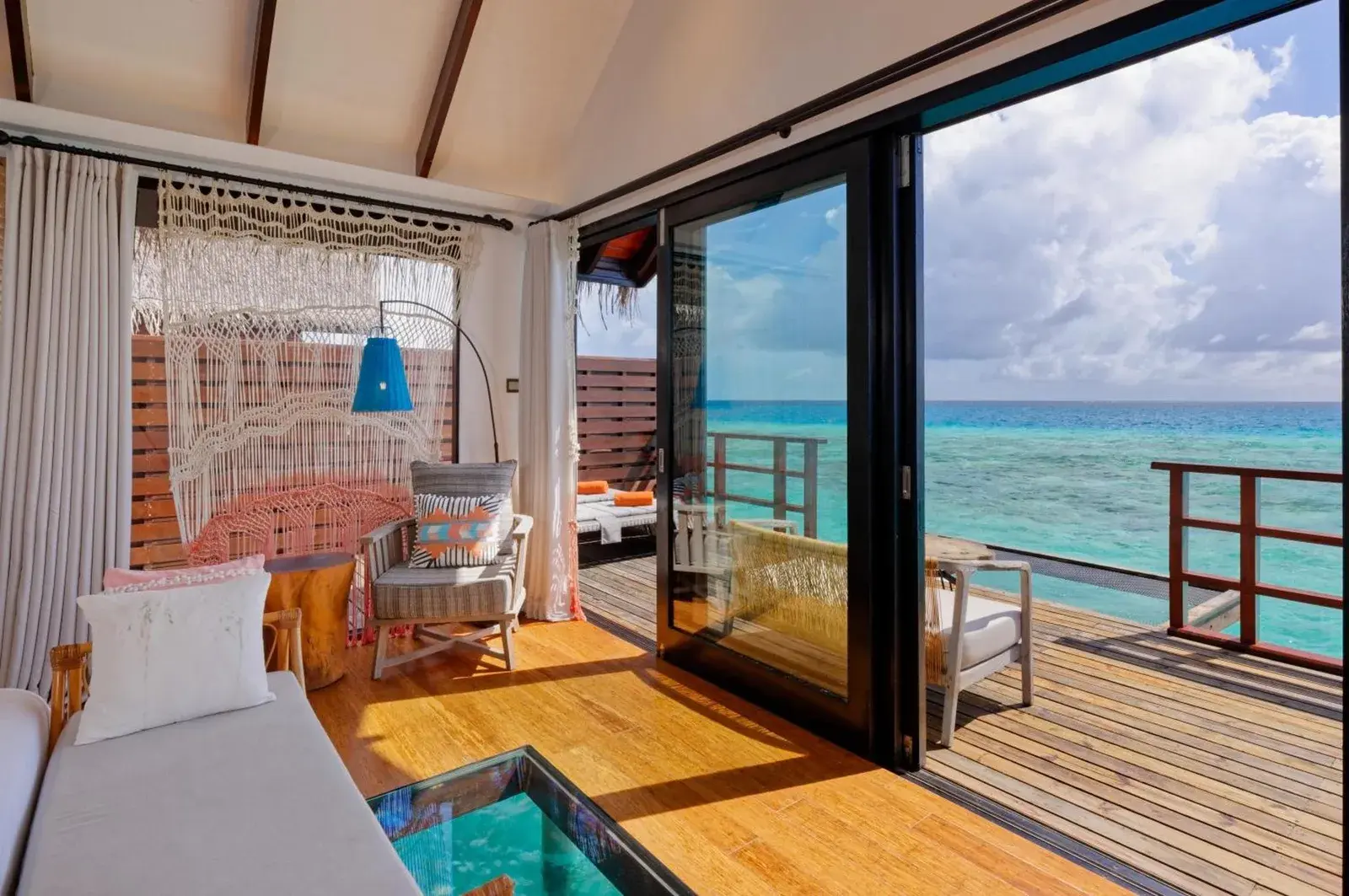 Living area with ocean view at Grand Park Kodhipparu Maldives