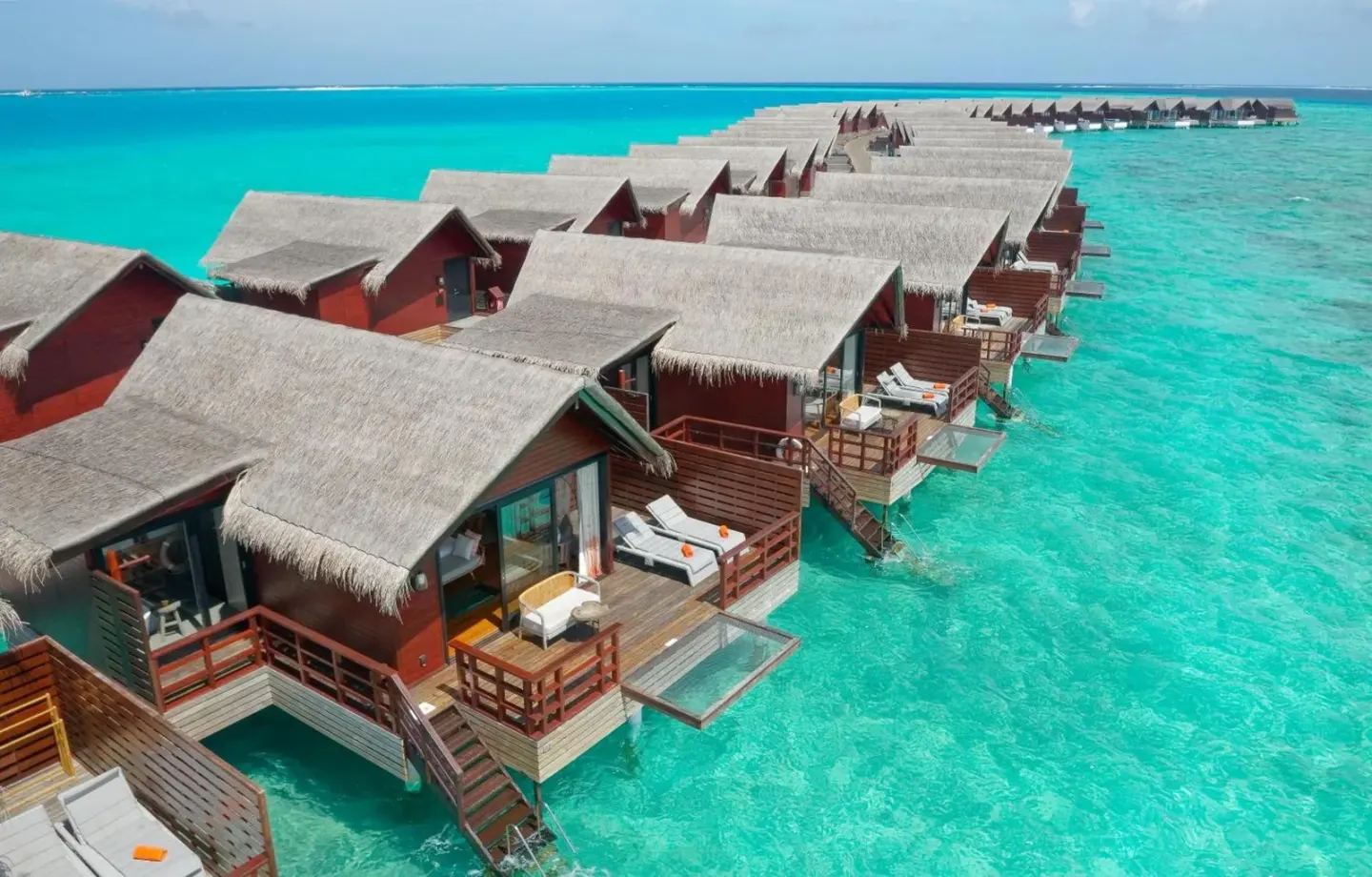 Row of overwater villas at Grand Park Kodhipparu Maldives
