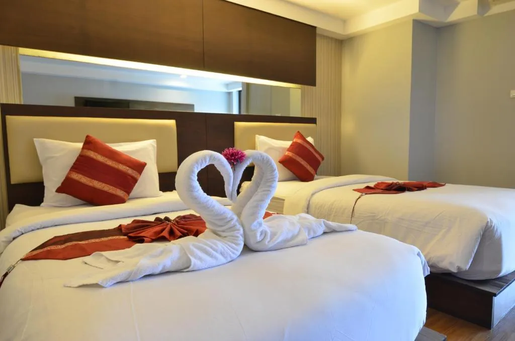 Grand Tara Garden Thai Hotel twin room with decorative towels