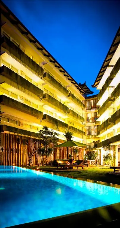 Exterior view of Grandmas Plus Hotel Airport Bali at night