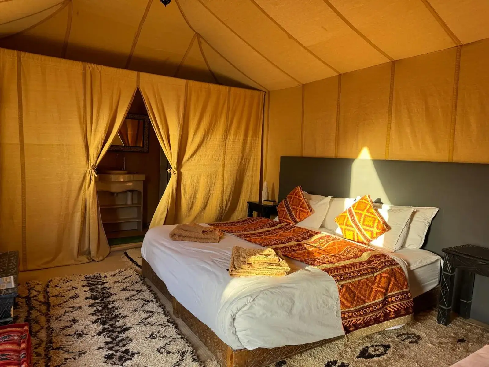 Cozy setup of a tent at Hagra Luxury Camp Merzouga