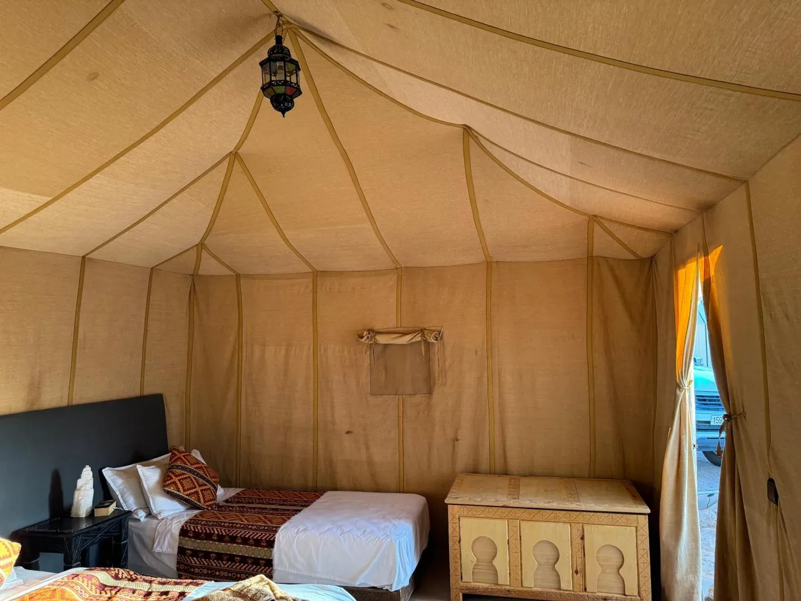 Empty interior of a tent at Hagra Luxury Camp Merzouga