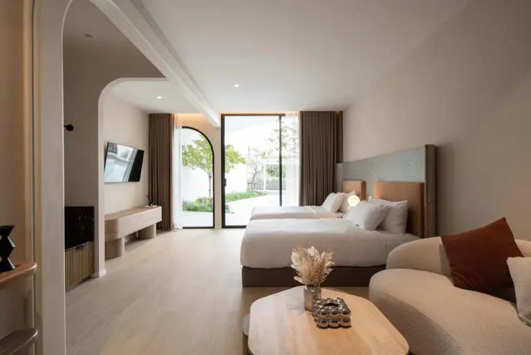 Halff Hotel Chanthaburi twin bed room with seating area and garden view