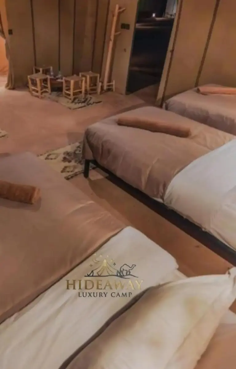 Bed setup in a tent at Hideaway Luxury Camp