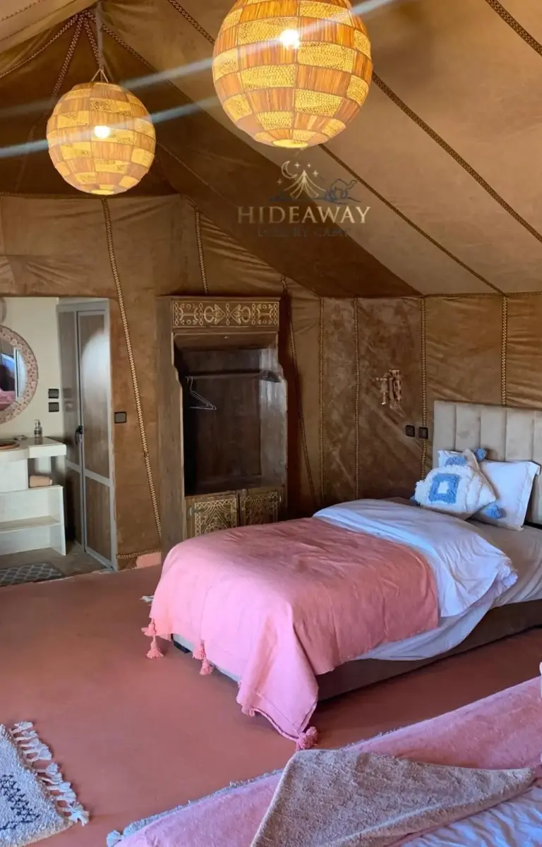Interior of a deluxe tent at Hideaway Luxury Camp