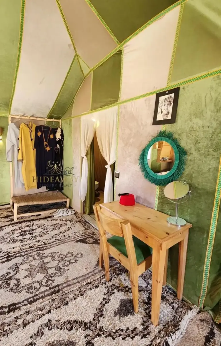 Green themed room in a tent at Hideaway Luxury Camp