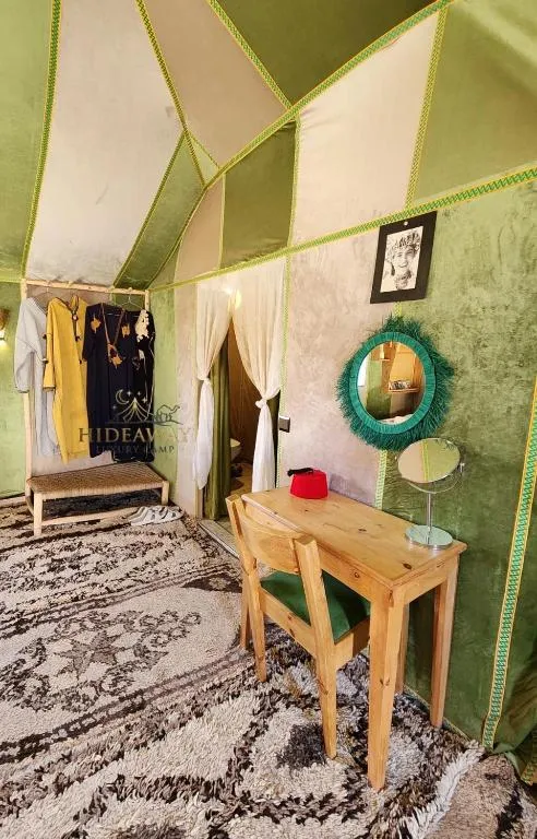 Green themed room in a tent at Hideaway Luxury Camp