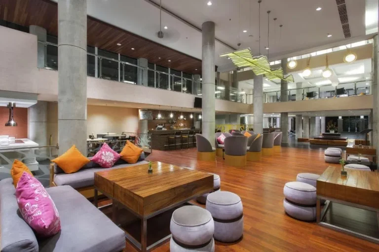 Hilton Garden Inn Bali Ngurah Rai Airport lounge space with cozy seating