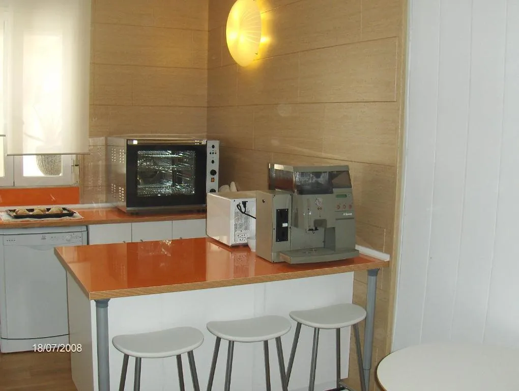 Kitchen area at Hostal Riesco in Madrid