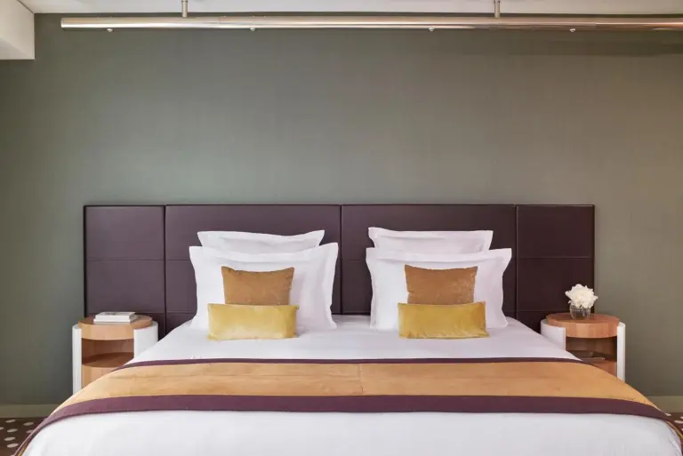Elegant bed in the room at Hôtel Barrière Lille