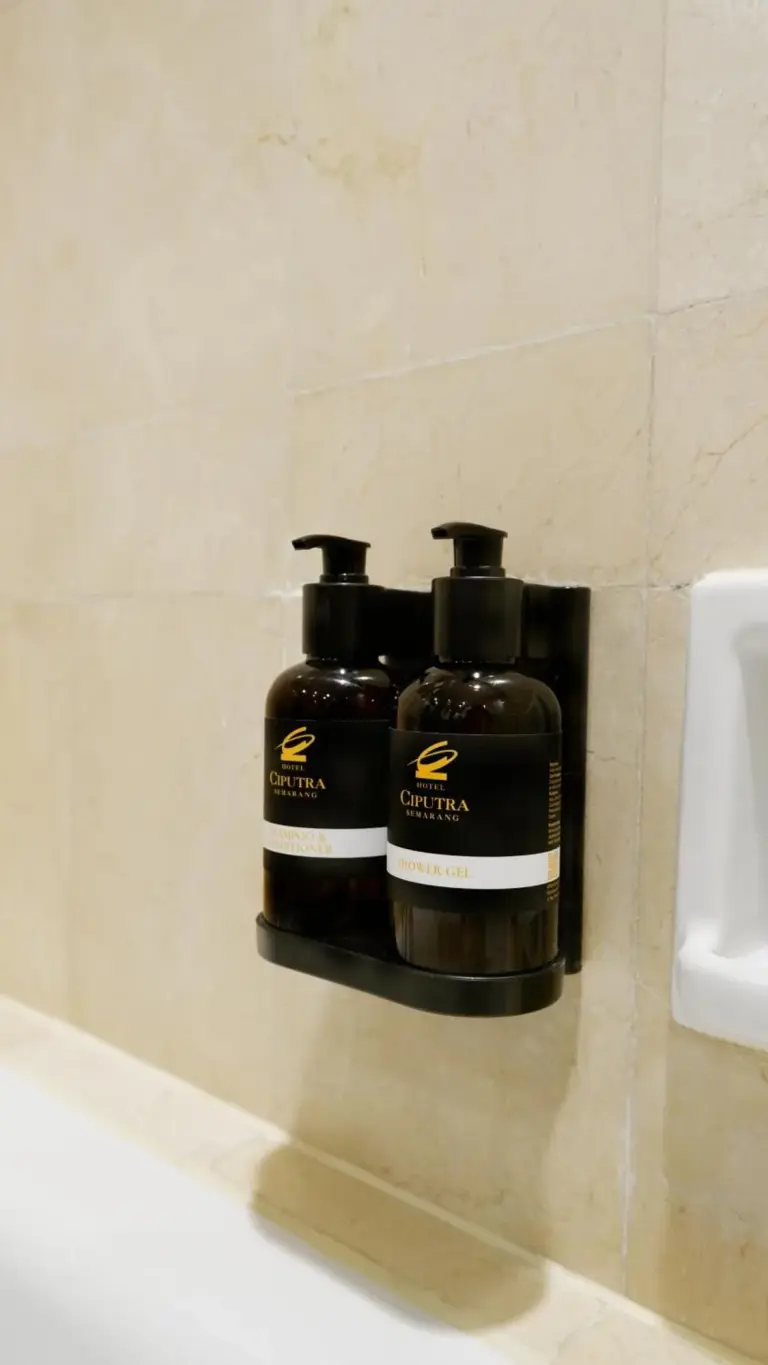 Hotel Ciputra Semarang bathroom toiletries mounted on the wall beside the bathtub