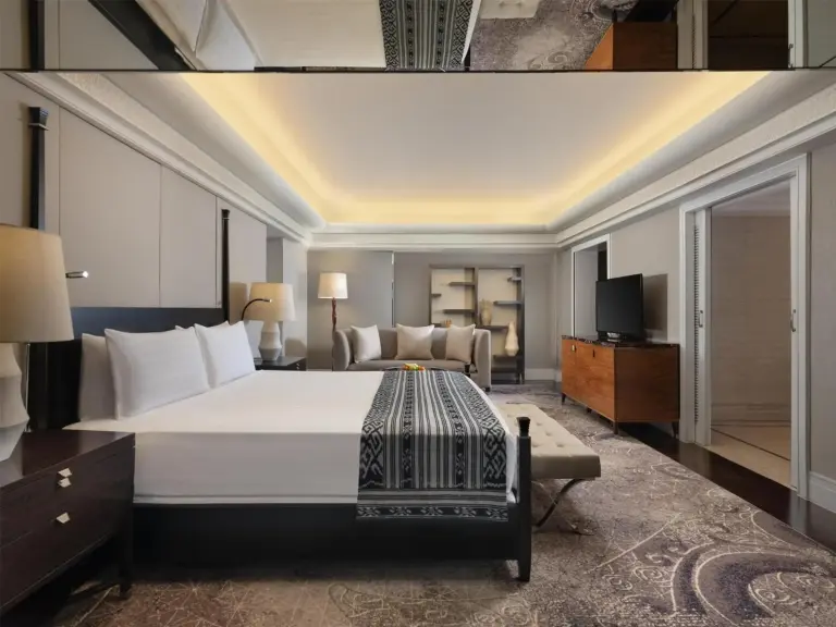 Spacious guest room in Hotel Indonesia Kempinski Jakarta with cozy seating area