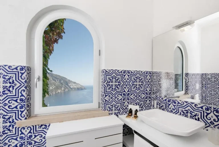 Stylish bathroom with coastal view at Hotel Le Agavi