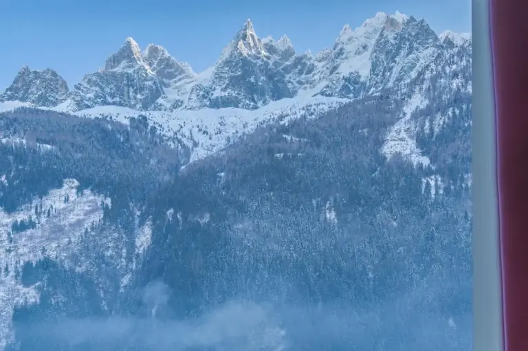 Breathtaking mountain view from Hôtel Mont-Blanc Chamonix, showcasing the snow-capped peaks in the distance.