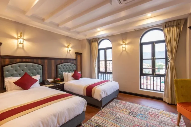 Twin beds in a guest room at Hotel Pabera Heritage Boutique in Kathmandu
