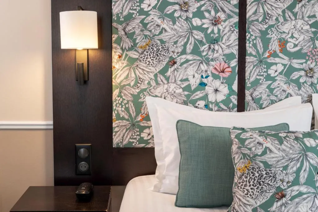 Decorative headboard in a room at Hotel Park Lane Paris