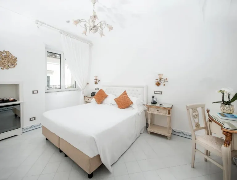 Elegant bedroom at Hotel Quisisana in Capri