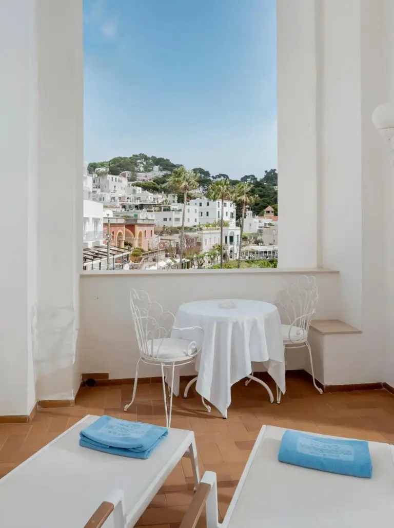 Outdoor seating area with views at Hotel Quisisana in Capri