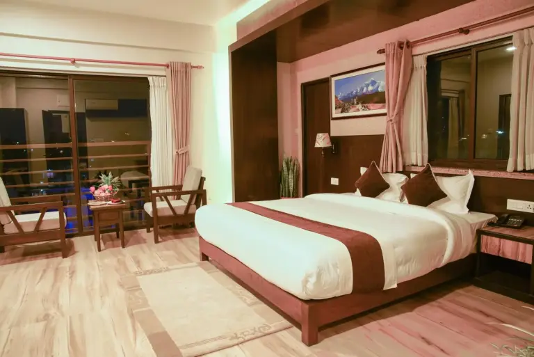 Hotel Shaara Pokhara superior room with large bed, desk, and window view