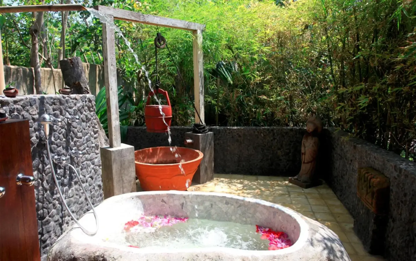 Outdoor bathing area at Hotel Tugu Lombok