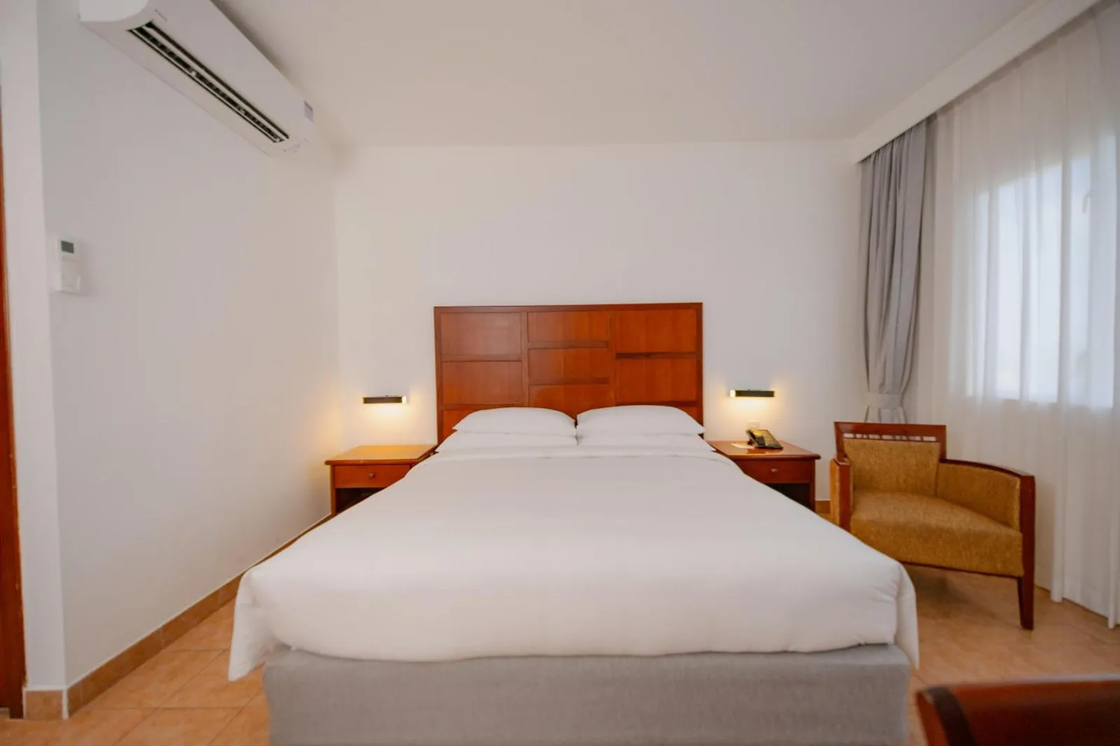 Hulhule Island Hotel guest room with a spacious layout
