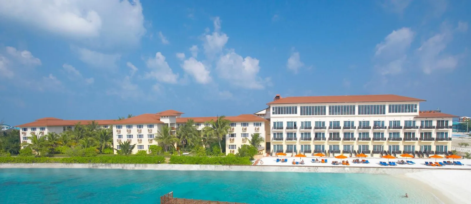 Hulhule Island Hotel exterior view showcasing private beach access
