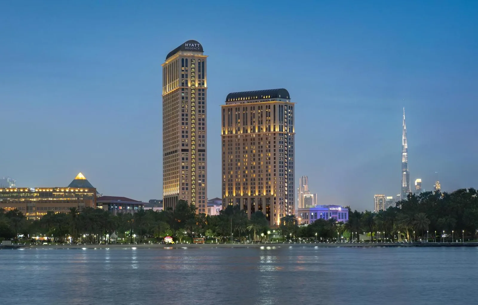Exterior view of Hyatt Regency Dubai Creek Heights in Dubai with skyline and waterfront at dusk