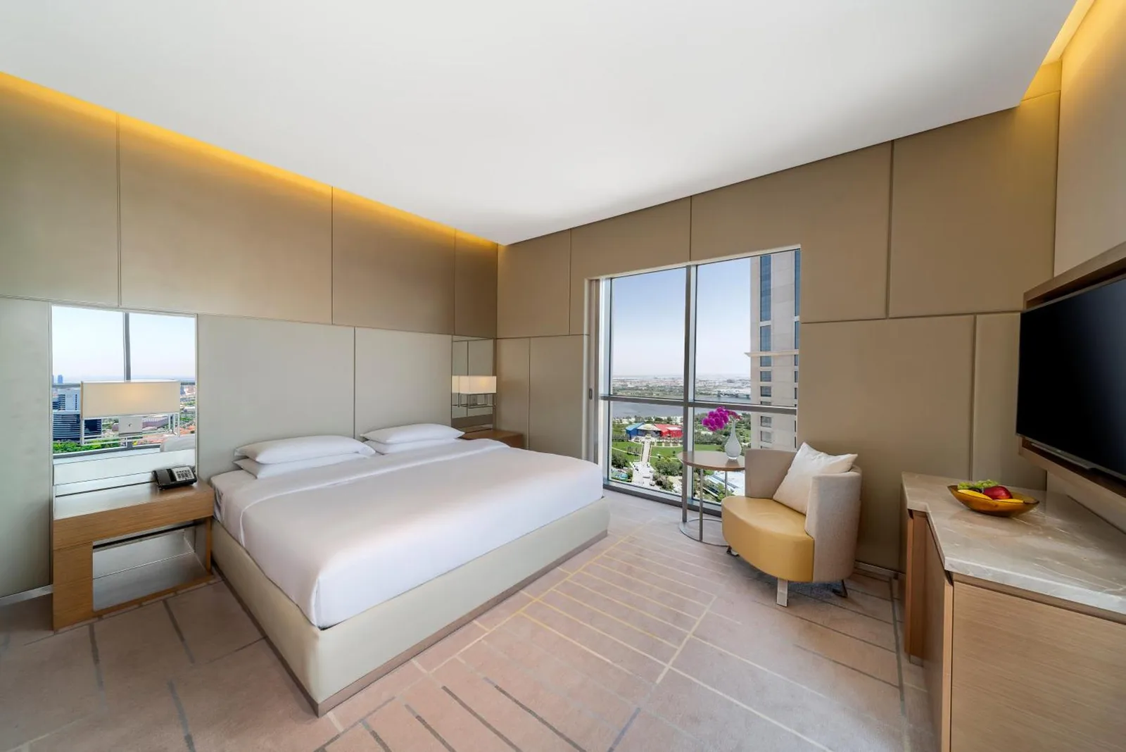 Bright king guest room at Hyatt Regency Dubai Creek Heights in Dubai with city views and modern decor