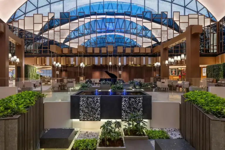 Grand lobby atrium at Hyatt Regency Dubai Creek Heights in Dubai with geometric glass ceiling and seating