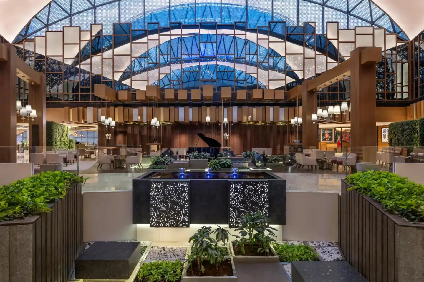 Grand lobby atrium at Hyatt Regency Dubai Creek Heights in Dubai with geometric glass ceiling and seating