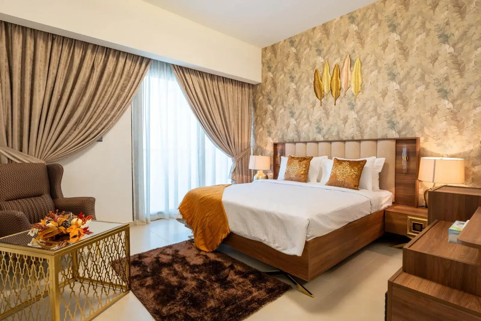 INA Homes luxurious bedroom with golden accents