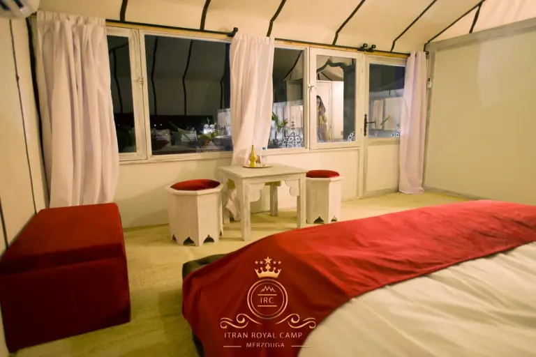 Red-themed interior of a tent at ITRAN ROYAL CAMP.