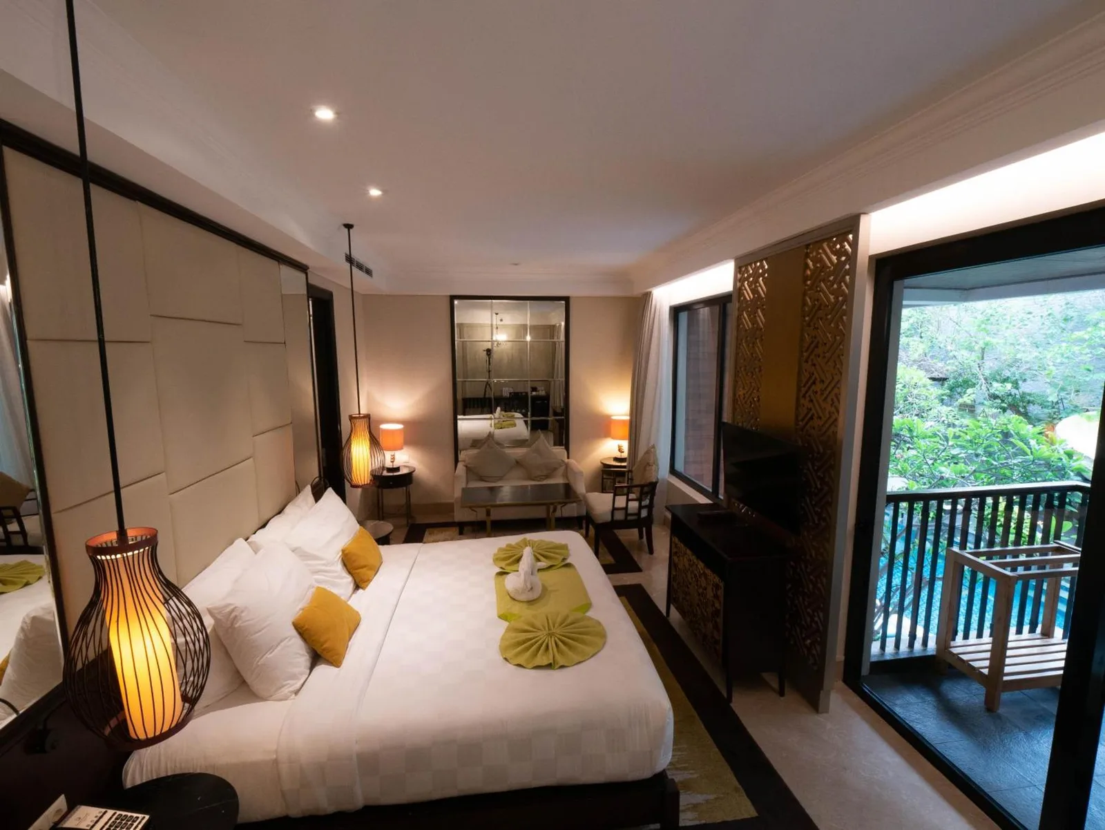 Bedroom with balcony at Jambuluwuk Oceano Seminyak Hotel in Seminyak, Bali