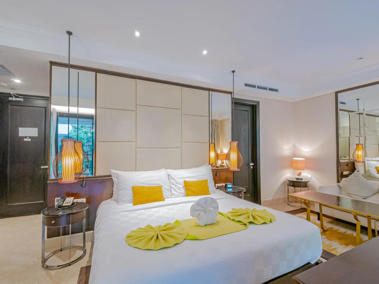 Elegant bedroom suite at Jambuluwuk Oceano Seminyak Hotel in Bali