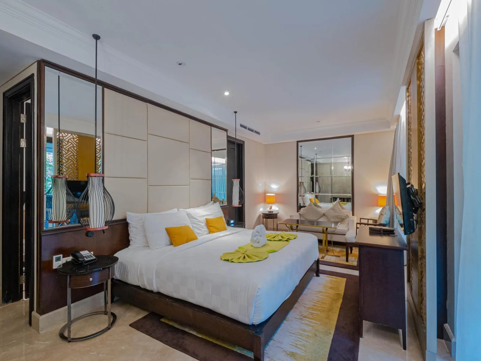 Cozy living area inside Jambuluwuk Oceano Seminyak Hotel room